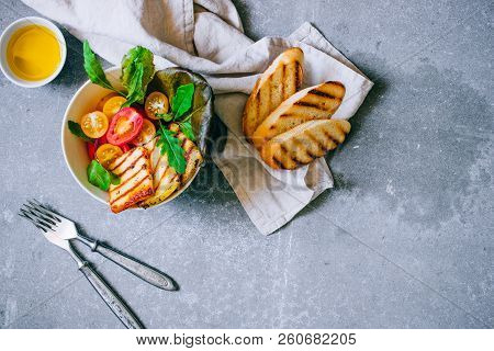 Cherry Tomato Salad With Grilled Haloumi Cheese, With Chard And Arugula