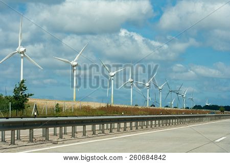 Large View On The Windmills On The Field
