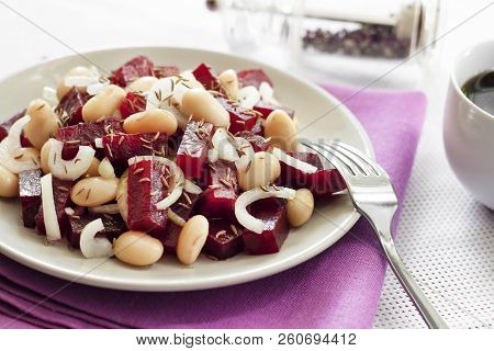 Beetroot Salad With White Kidney Beans, Pickles And Onion, Dressed With Oil And Flavored With Carawa