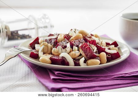 Beetroot Salad With White Kidney Beans, Pickles And Onion, Dressed With Oil And Flavored With Carawa