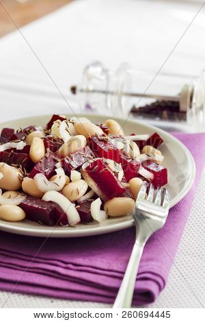 Beetroot Salad With White Kidney Beans, Pickles And Onion, Dressed With Oil And Flavored With Carawa