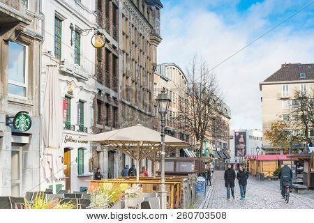 AACHEN, GERMANY - November 19, 2017: Tourists on foot Street in Aachen, Germany. Aachen was a residence of Charlemagne, and later the coronation place for German kings, Aachen, Germany