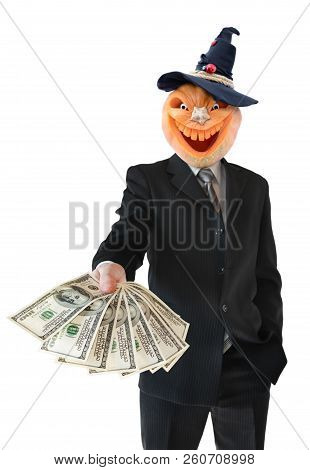Portrait Of Jack Lantern  From Pumpkin In Black Business Suit. Jack Lantern Keeps Money In His Hands