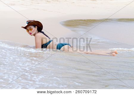 Woman Shape Pretty With Bikini And Hat Relax On Beach At Bang Beot Beach, Chumphon Province Thailand