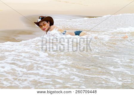 Woman With Bikini And Hat Happy Wave On Beach At Bang Beot Beach, Chumphon Province Thailand