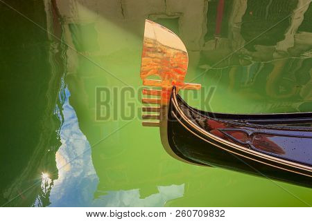Venice: Reflections, Lights And Colors. Particular Of The Iron Prow-head Of The Gondola. The Ornamen