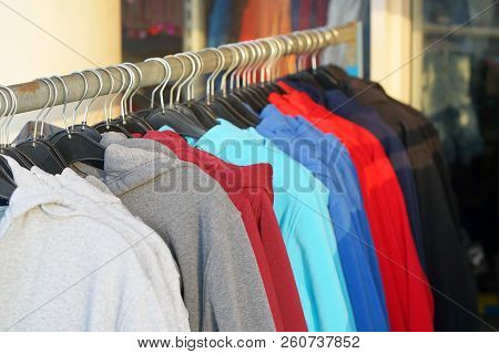 Clothes Hanger With Sports Warm Jacket. Fashionable Clothing On Hangers In Shop. Sports Warm Jacket 
