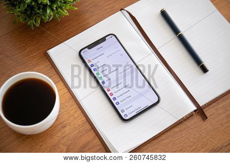 Alushta, Russia - September 26, 2018: Iphone X With Settings On The Screen And Wooden Table. Iphone 
