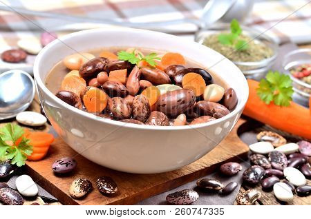 Bean Soup With Large Beans, Carrots, Parsley, Marjoram, Spoon And Ladle
