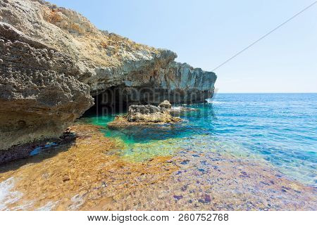 Apulia, Grotto Verde, Italy - Turquoise Water At The Coastline Of Grotto Verde