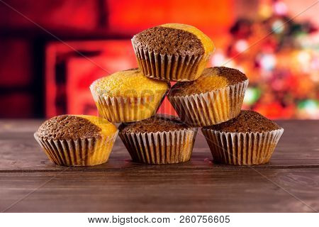 Set Of Six Whole Fresh Baked Marble Muffin With Christmas Tree In Red Background