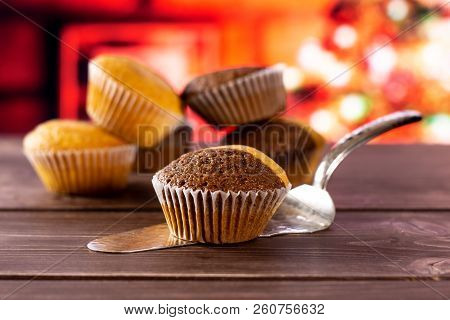 One Whole Fresh Baked Marble Muffin On Silver Cake Server With Christmas Tree In Red Background