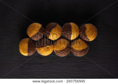 Group Of Eight Whole Fresh Baked Marble Muffin Flatlay On Grey Stone