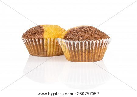 Group Of Two Whole Sweet Fresh Baked Marble Muffin Isolated On White Background