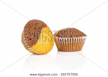Group Of Two Whole Tasty Fresh Baked Marble Muffin Isolated On White Background