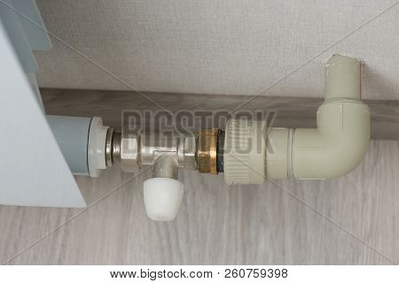 Modern Heating Batteries. Bimetallic Heating Battery. Pipe To The Battery. Battery Cock