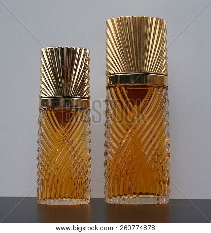 Fragrance For Ladies, Large Perfume Bottle Next To A Commercial Perfume Bottle
