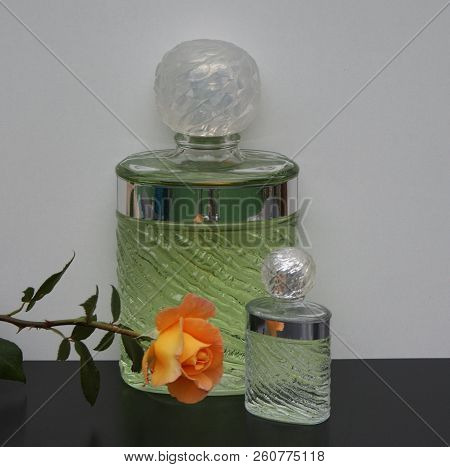 Fragrance For Ladies, Large Perfume Bottle Next To A Commercial Perfume Bottle Decorated With An Eng