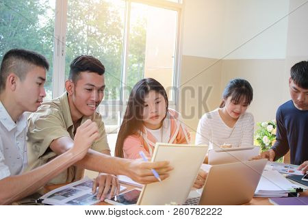 Co Working Team Meeting Concept: New Asian Genaration Business People Working And Studying Together 