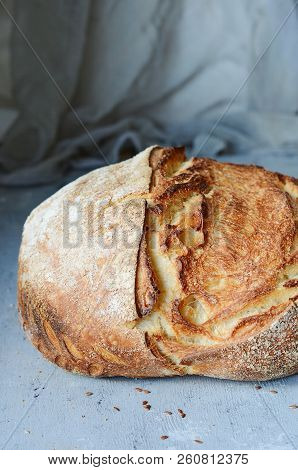 Fresh Homemade Bread From Whole Wheat And Rye Flour With Flax Seeds, Pumpkin And Oat Flakes On A Bro