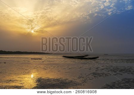 Traditional Fishing Canoes At The Beach In The Island Of Orango At Sunset, In Guinea Bissau. Orango 