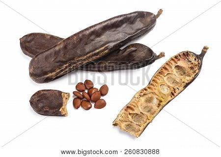 Carobs Pod With Beans Isolated On White Background