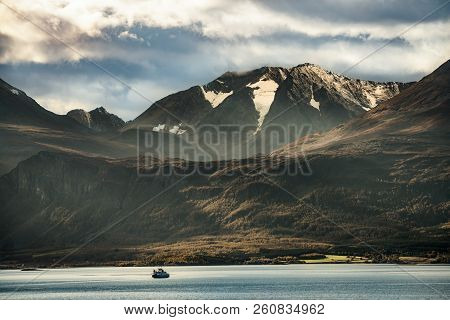 Mountains Landscape With Fjord Crossing By Ferry In North Norway