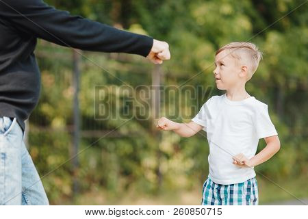 Little Boy Learns Methods Of Fighting, Boxing, Aimed Fist Man. Concept Protection Against Bullies.