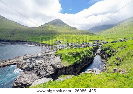 Beautiful View Of Sunshine Gjogv Village With Various Colorful Pastel Houses In Front Of Mountains V