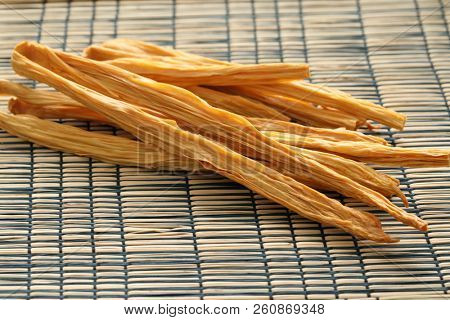 Dried yuba sticks, the soybean product also known as fuju, fuzhu, or tofu skin