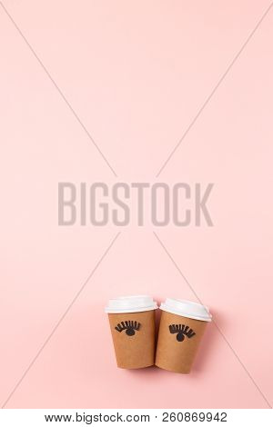 Two Craft Cups To Do On The Pastel Pink Background. Decorated With Funny Cute Paper Eyes. Wake Up An