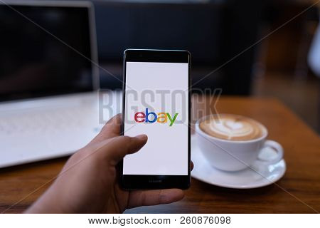 Chiang Mai, Thailand - May 19,2018: Man Holding Huawei With Ebay Apps On The Screen. Ebay Is One Of 
