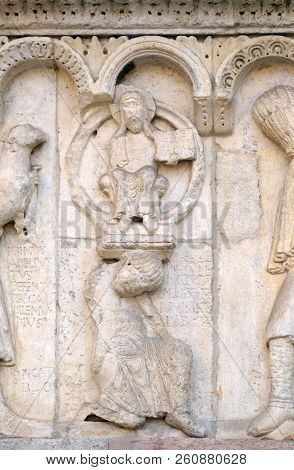 MODENA, ITALY - JUNE 04: Plate with stories from Genesis: Story about Abel and Cain, God the Father, relief by Wiligelmo, Modena Cathedral, Italy on June 04, 2017.