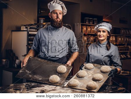 Cooking Master Class In Bakery. Chef With His Assistant Showing Ready Samples Of Baking Test In Kitc