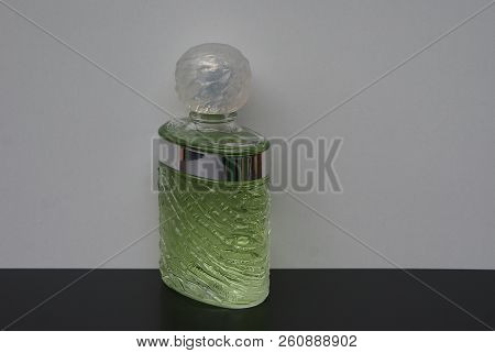 Fragrance For Ladies, Large Perfume Bottle In Front Of A White Background