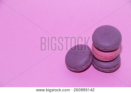 Macaroni On A Gently Pink Background. Delicious Cakes For Tea. Dessert Close-up.