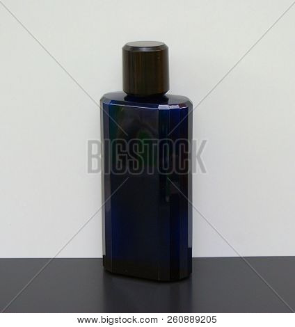 Eau De Toilette, Large Perfume Bottle In Front Of White Background