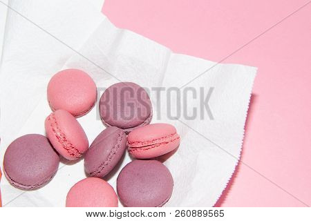 Macaroni On A Gently Pink Background. Delicious Cakes For Tea. Dessert Close-up.