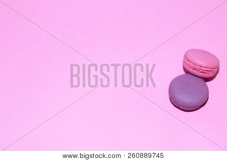 Macaroni On A Gently Pink Background. Delicious Cakes For Tea. Dessert Close-up.