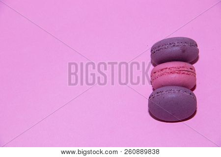 Macaroni On A Gently Pink Background. Delicious Cakes For Tea. Dessert Close-up.
