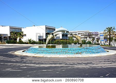 Albufeira, Portugal - June 12, 2017 - Three Dolphin Fountain In The Centre Of A Traffic Island, Albu