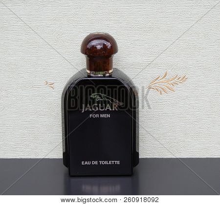 Jaguarfor Men, Eau De Toilette, Large Perfume Bottle In Front Of The Satin Wallcovering Elysee