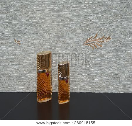 Diva, Fragrance For Ladies, Large Perfume Bottle Next To A Commercial Perfume Bottle In Front Of The