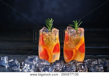 Gin Cocktail With Rosemary And Ice Cube On Ablack Background, Sel