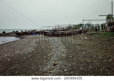 Lankaran, Azerbaijan - Apr 18 2011: Caspian Sea Shore With Fishing Boats Waiting To Sail Out