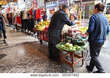 Keelung, Taiwan - November 23, 2018: Street Vendor Sells Fruit In Keelung, Taiwan. Markets Are Essen