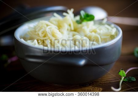 Sweet Boiled Vermicelli With Milk In A Ceramic Bowl
