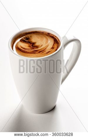 Delicious americano lungo coffee in white ceramic mug. White background. Highest quality of coffee g