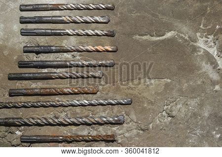 Drills On Concrete Of Different Diameter And Degree Of Novelty For A Perforator Lie On A Concrete Pl