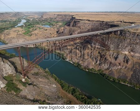 Perrine Bridge - Distant Aerial View Over River Canyon With Cars Driving On Road